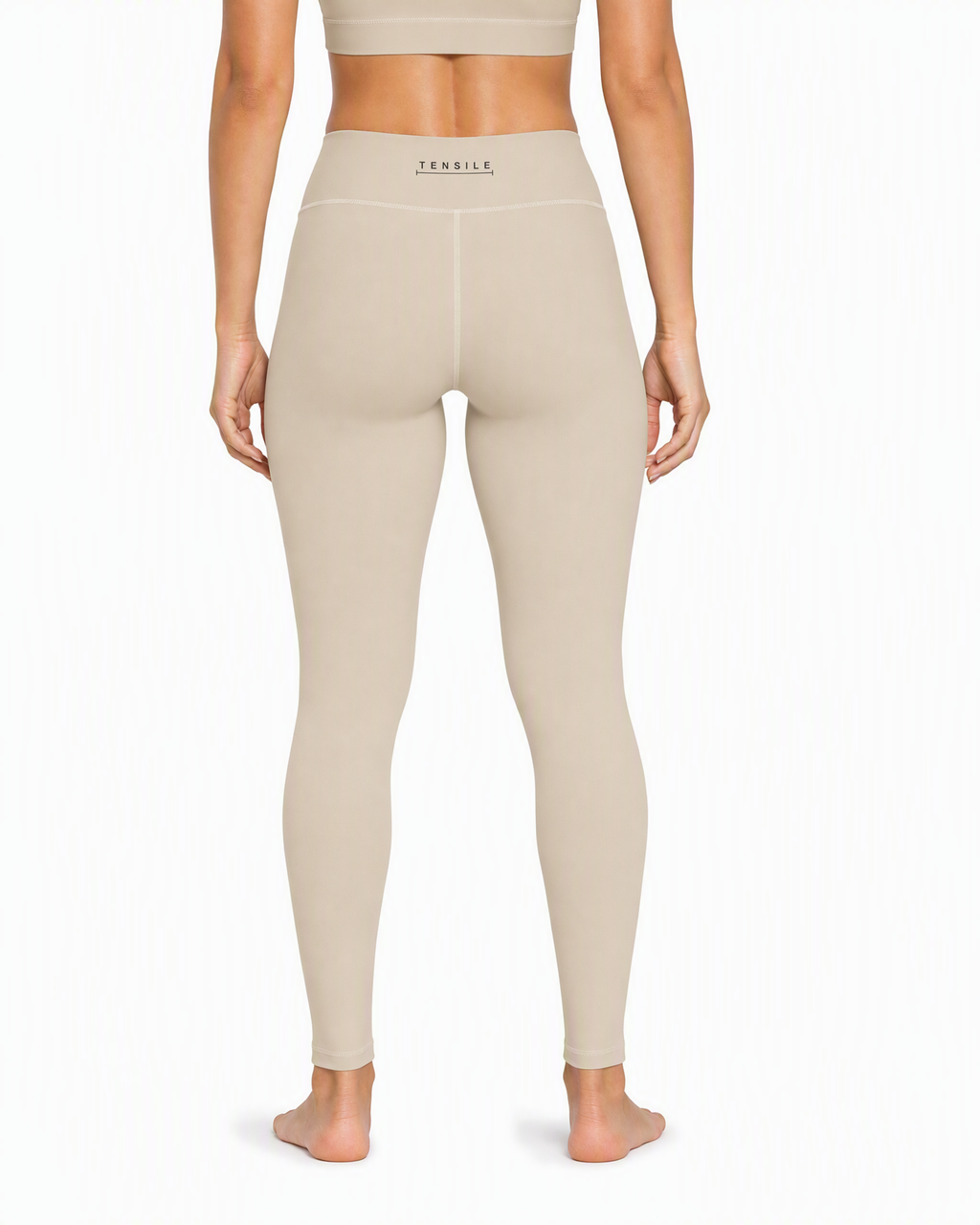 TENSILE High-Rise Legging in sand, rear view showing back waistband mark